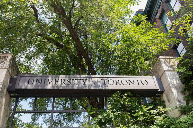 University of Toronto sign shaded by large tree